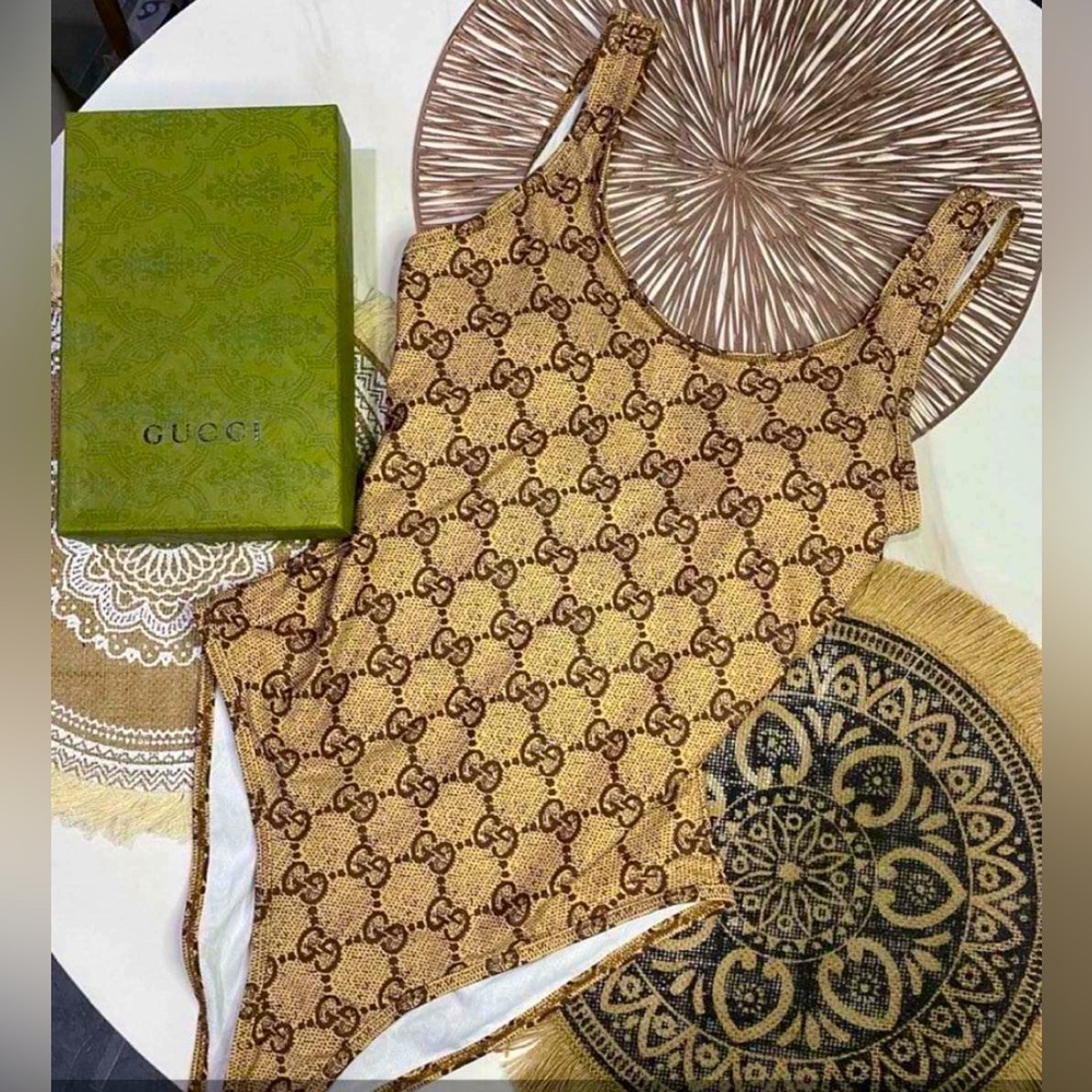 Beautiful fashion designer bathing suit with tags .